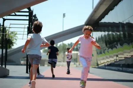 strength Kids running across an obstacle course